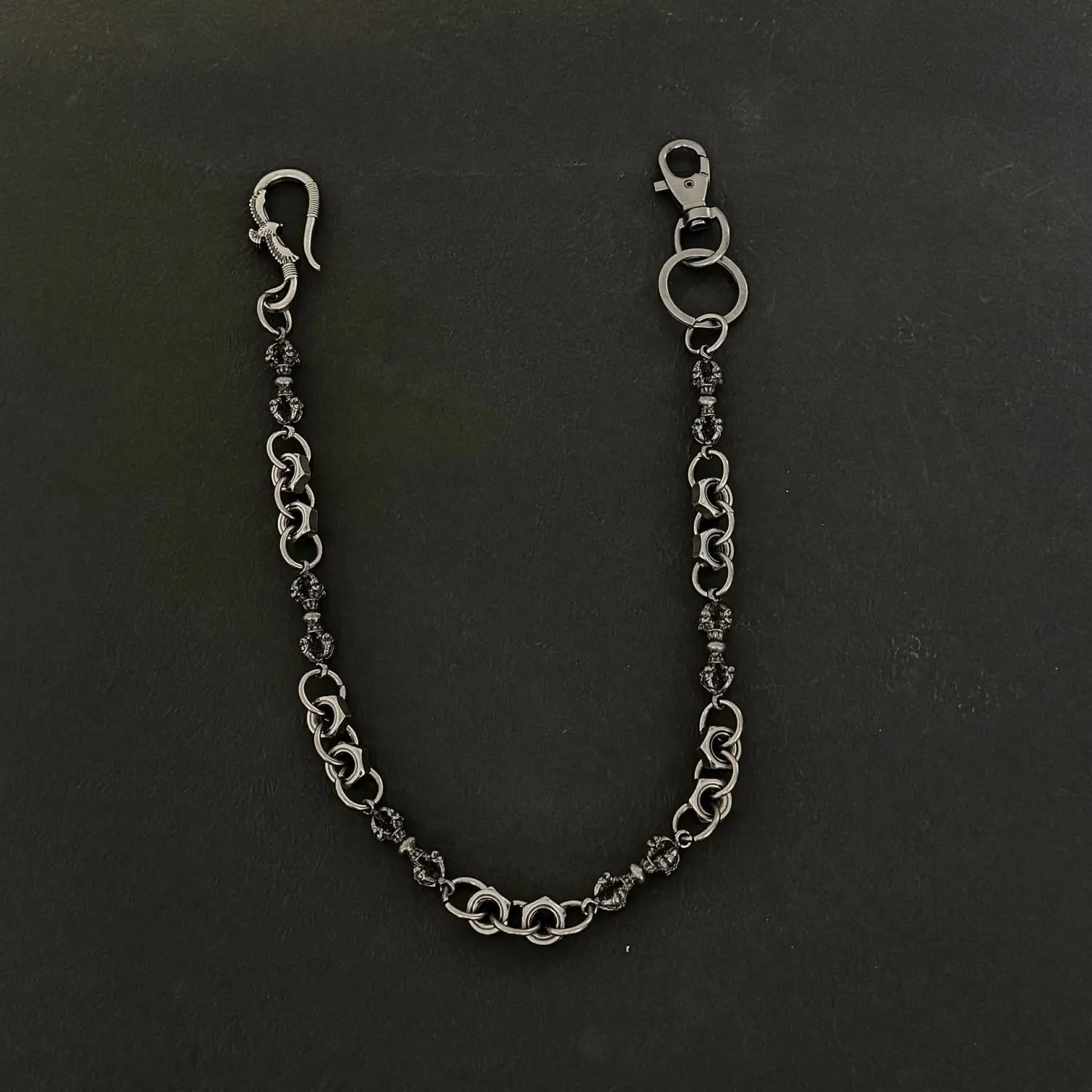 Men eagle punk trouser chain featuring silver-toned ornate interlocking links with dark embellished beads as a heavy metal wallet accessory.