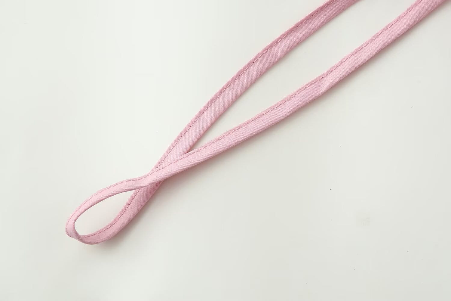 a delicate pink leather strap with fine stitching complements the slim-fit design and round neckline of the women slim fit long sleeve round neck top