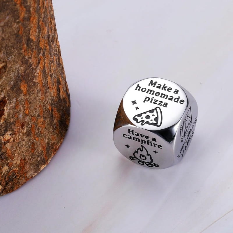 silver-toned stainless steel six-sided food decision die ring engraved with camping-themed phrases and illustrations for couples date night