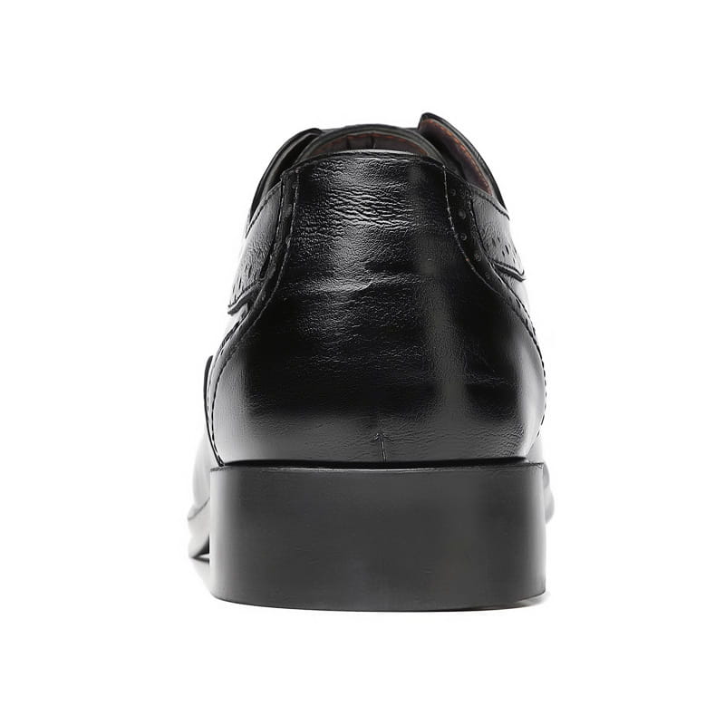 Men’s leather brogue dress shoe in black featuring a polished finish and classic brogue detailing.