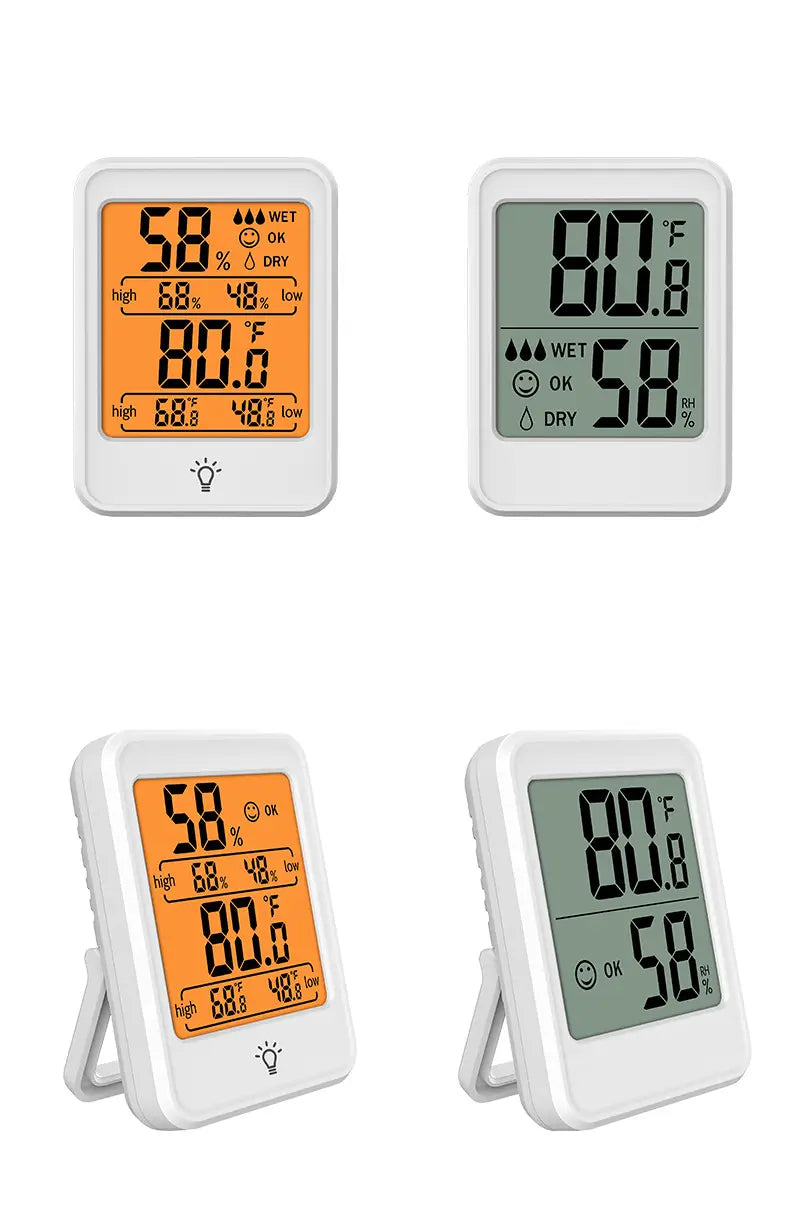 Medidor digital interior de temperatura y humedad blanco con soporte, que presenta una pantalla LCD naranja y verde que muestra la temperatura en Fahrenheit y el porcentaje de humedad.