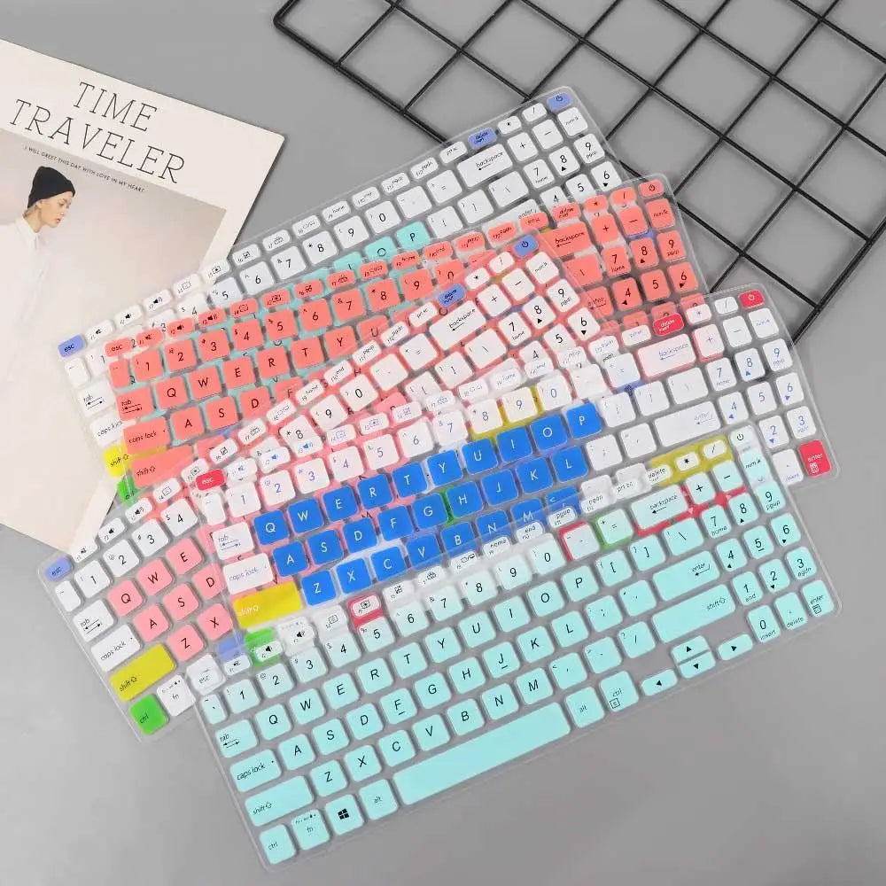 Transparente Silikon-Tastaturabdeckungen für Laptops mit farbenfrohen Gradienten-Tastendesigns in Pastellrosa, Blau, Grün und Gelb für 15,6-Zoll-Laptops.