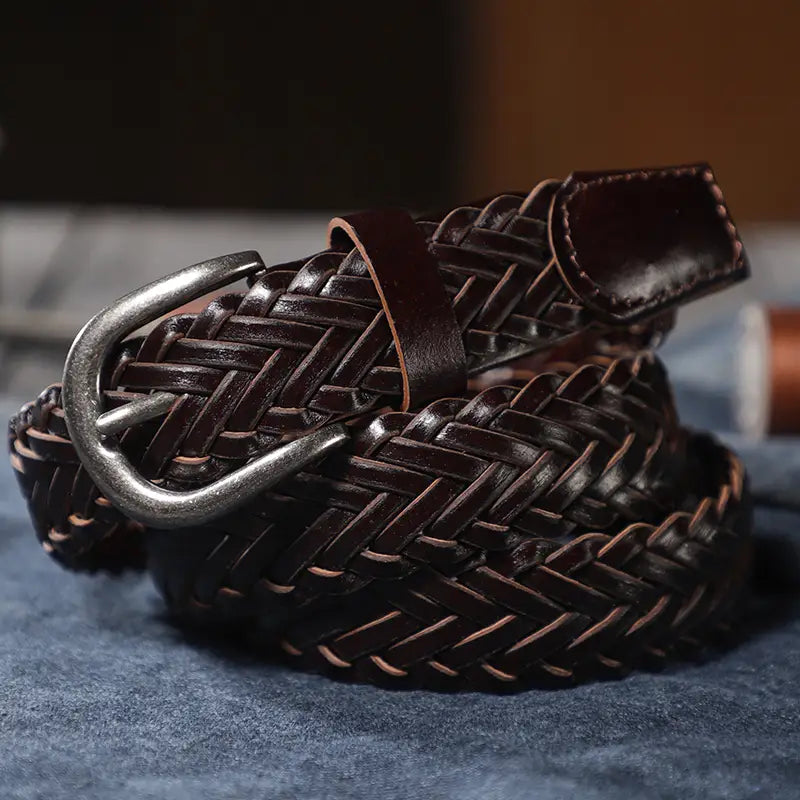 dark brown braided leather belt unisex casual woven accessory with silver toned buckle displayed front side