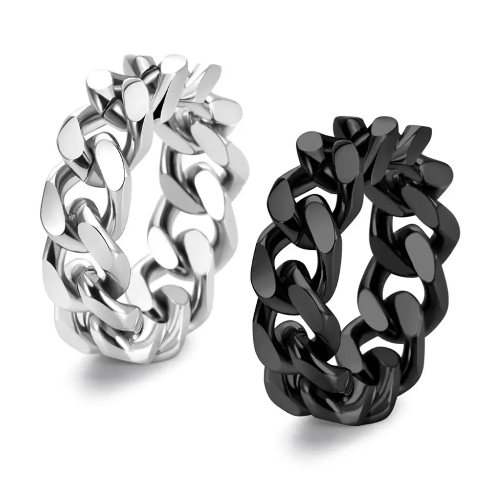 dos anillos de cadena cubana gruesos de acero titán, con acabados plateado pulido y negro mate, mostrados uno al lado del otro