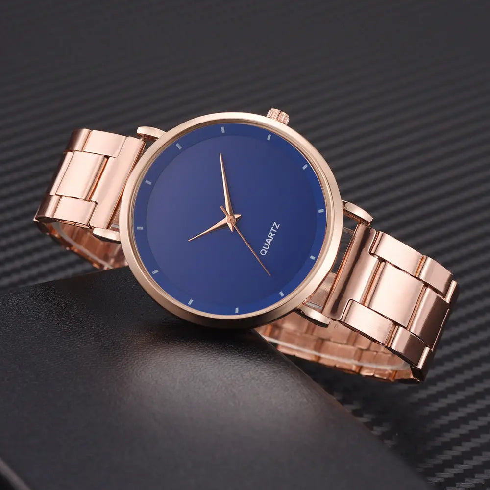Rose gold women luxury quartz wristwatch featuring a minimalist deep blue dial and metal band suitable for business use.