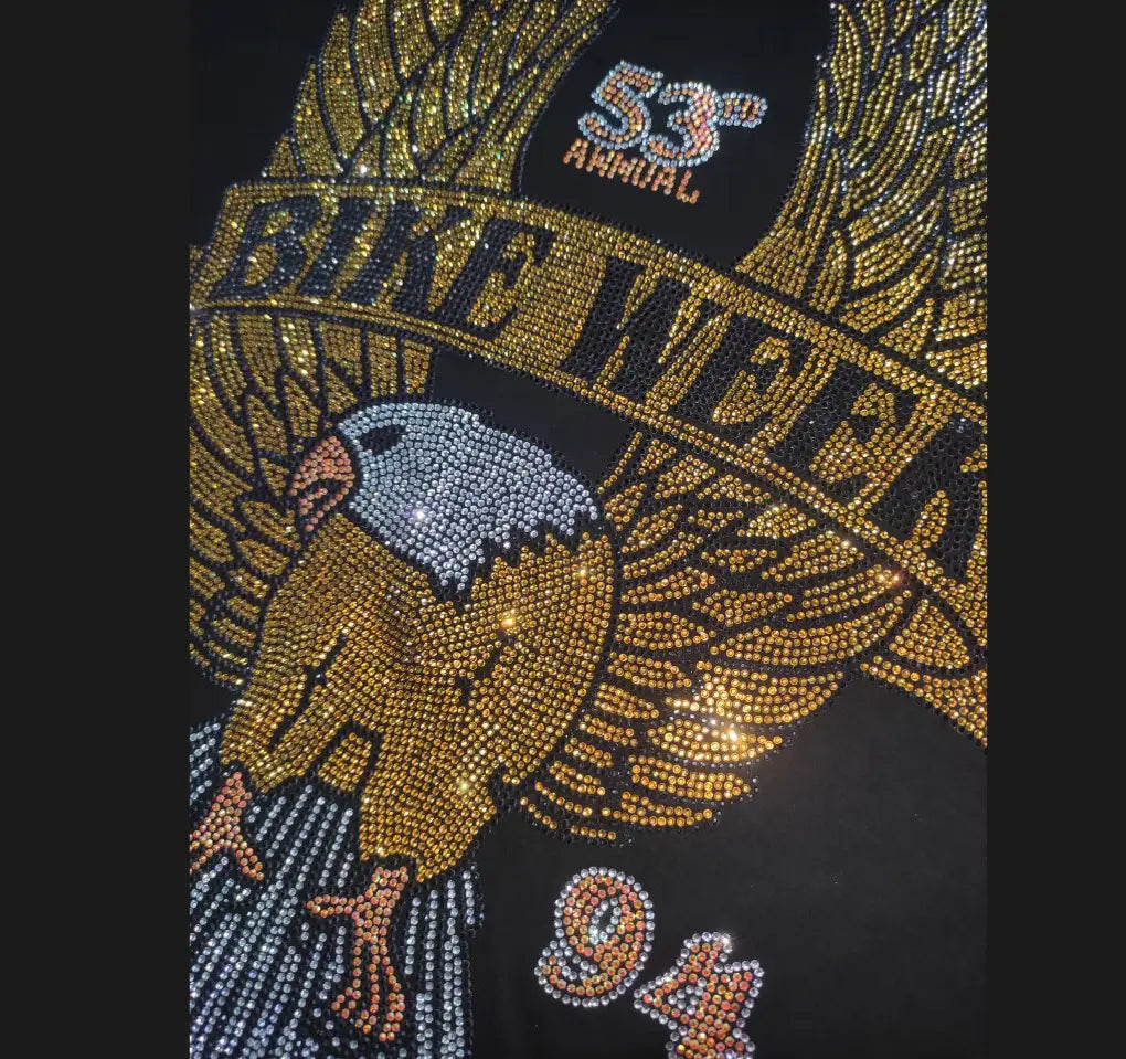Men rhinestone devil bear black t-shirt featuring a sparkling gold and silver rhinestone eagle design with bike week text and wings spread wide over the chest.