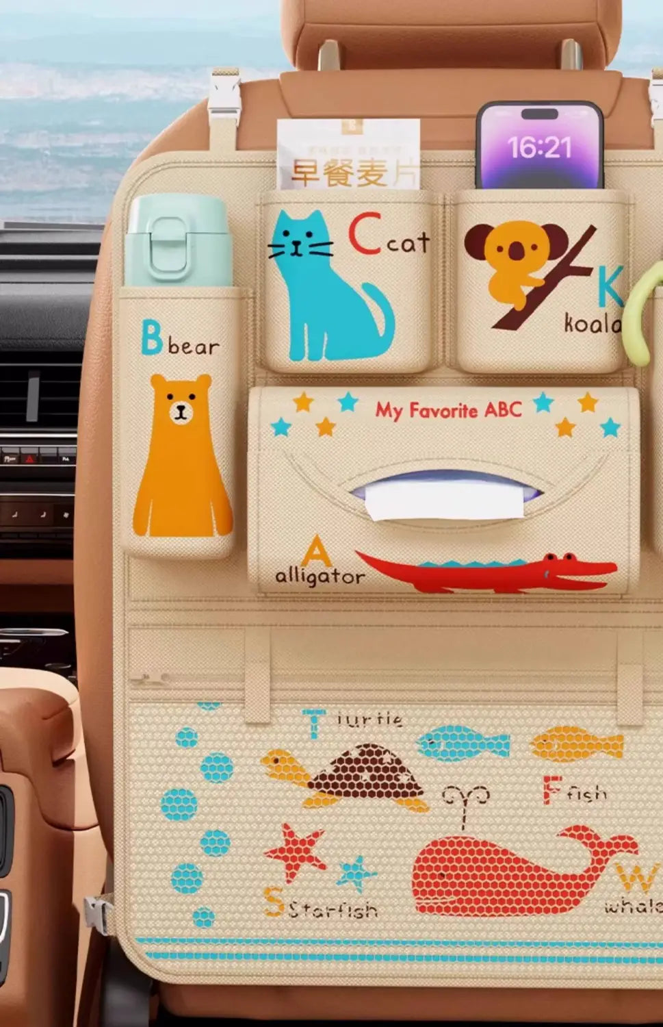 Beige car seat organizer featuring colorful animal-themed storage pockets with cartoon illustrations of bears cats koalas alligators turtles fish starfish and whales and an integrated tissue box for vehicle use.