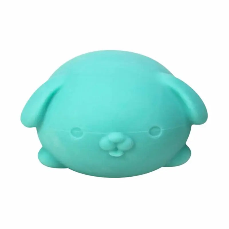 a soft mint-green silicone sensory fidget squishy toy shaped like a round sleepy puppy with simple embroidered eyes and nose viewed from the front featuring quick rebound design