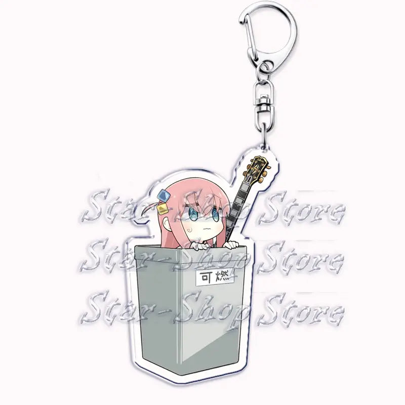 a pink-haired anime character with blue eyes and a gold hairpin peeks from a gray trash can-shaped acrylic keychain holding a miniature guitar in the anime character acrylic keychain bocchi the rock.