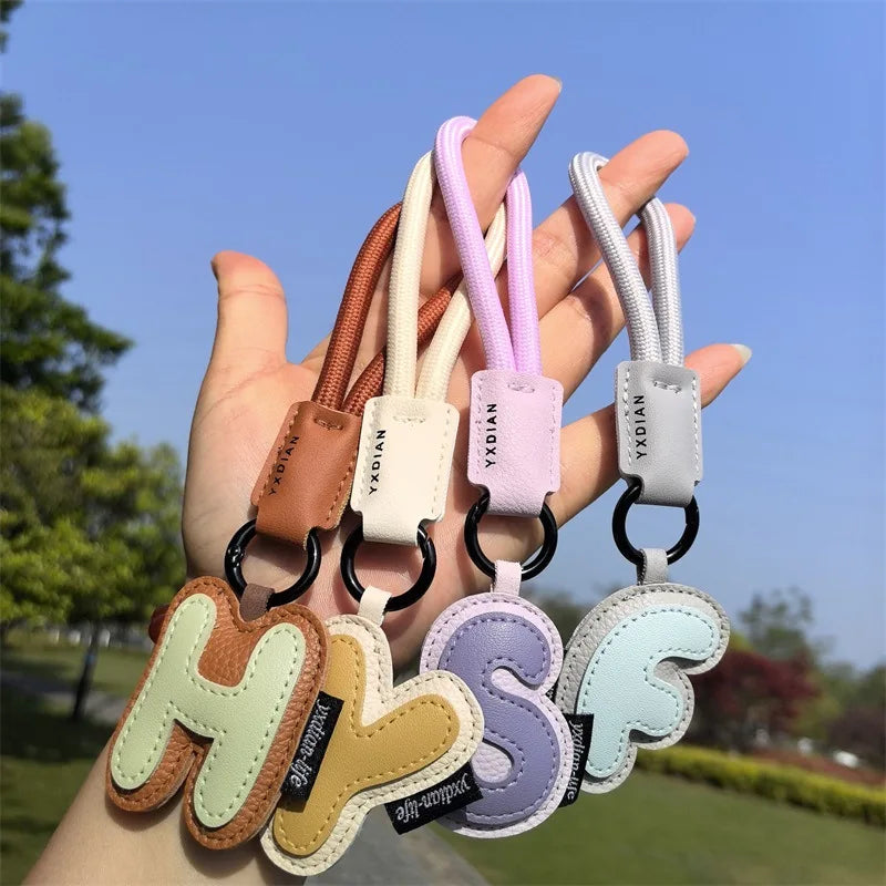 A To Z Leather Initials Keychain Braied Wristband Pendant Keyring for Women Men Car Bag Charms Camera Phone Case Accessories