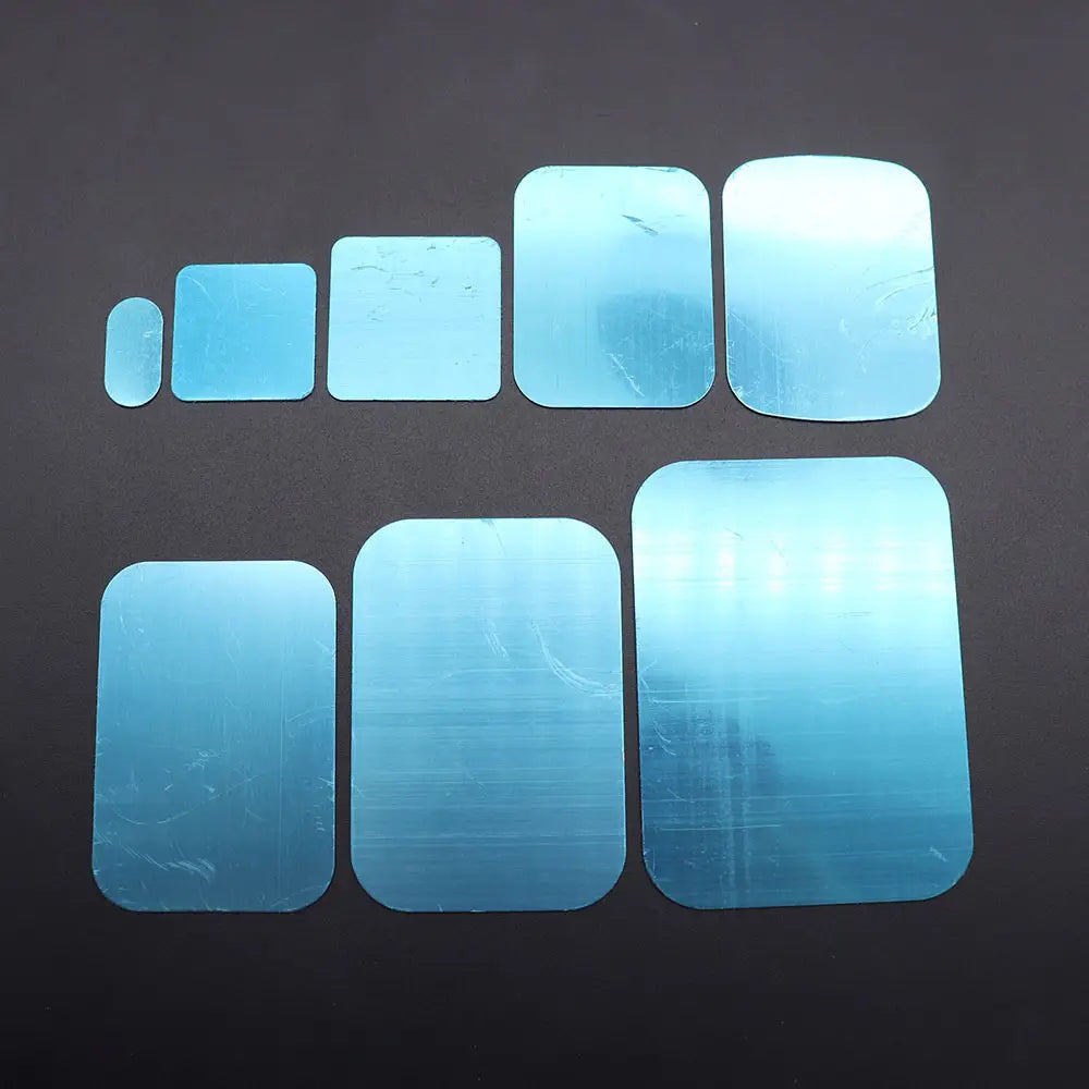 set of seven light blue rectangular metal plate disks with rounded corners in varying sizes for magnetic car phone holder use