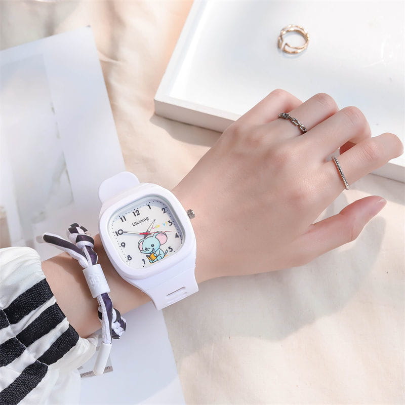 White rectangular kids luminous cartoon elephant digital watch with a matching white strap and a cartoon character on the face.