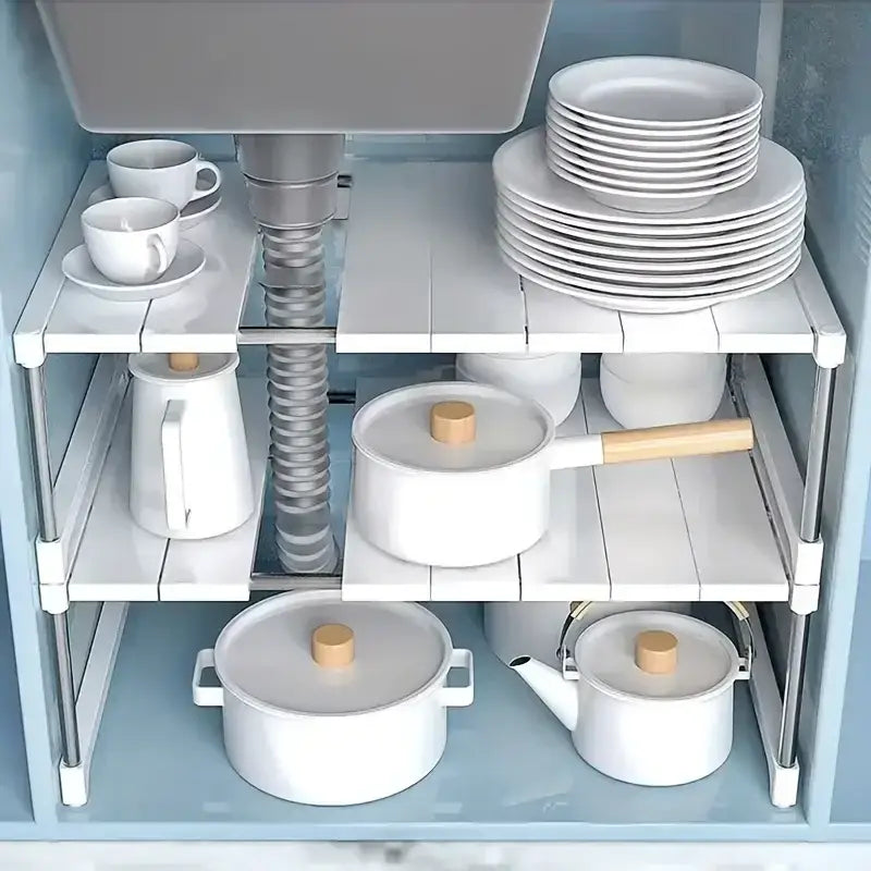 white modular under-sink shelf with silver metal frame and slatted surface designed as a telescopic sink holder layered partition rack for organized storage.