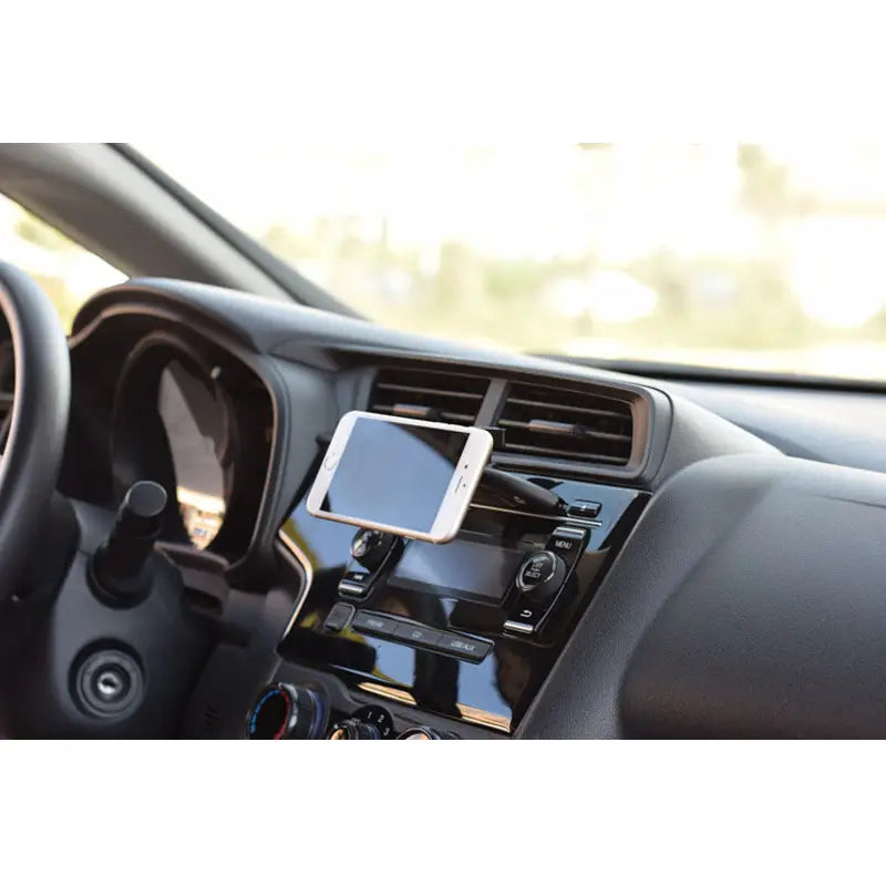 White smartphone mounted in a magnetic cd slot car phone mount showing the mini design suitable for gps navigation and iphone use