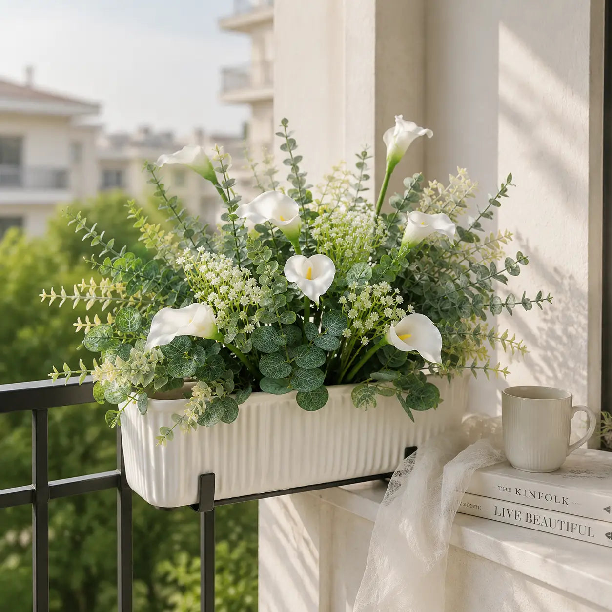 white ribbed ceramic planter holding an arrangement of artificial mixed flowers featuring white calla lilies and green foliage from the mixed flowers 48pcs wedding bouquet set