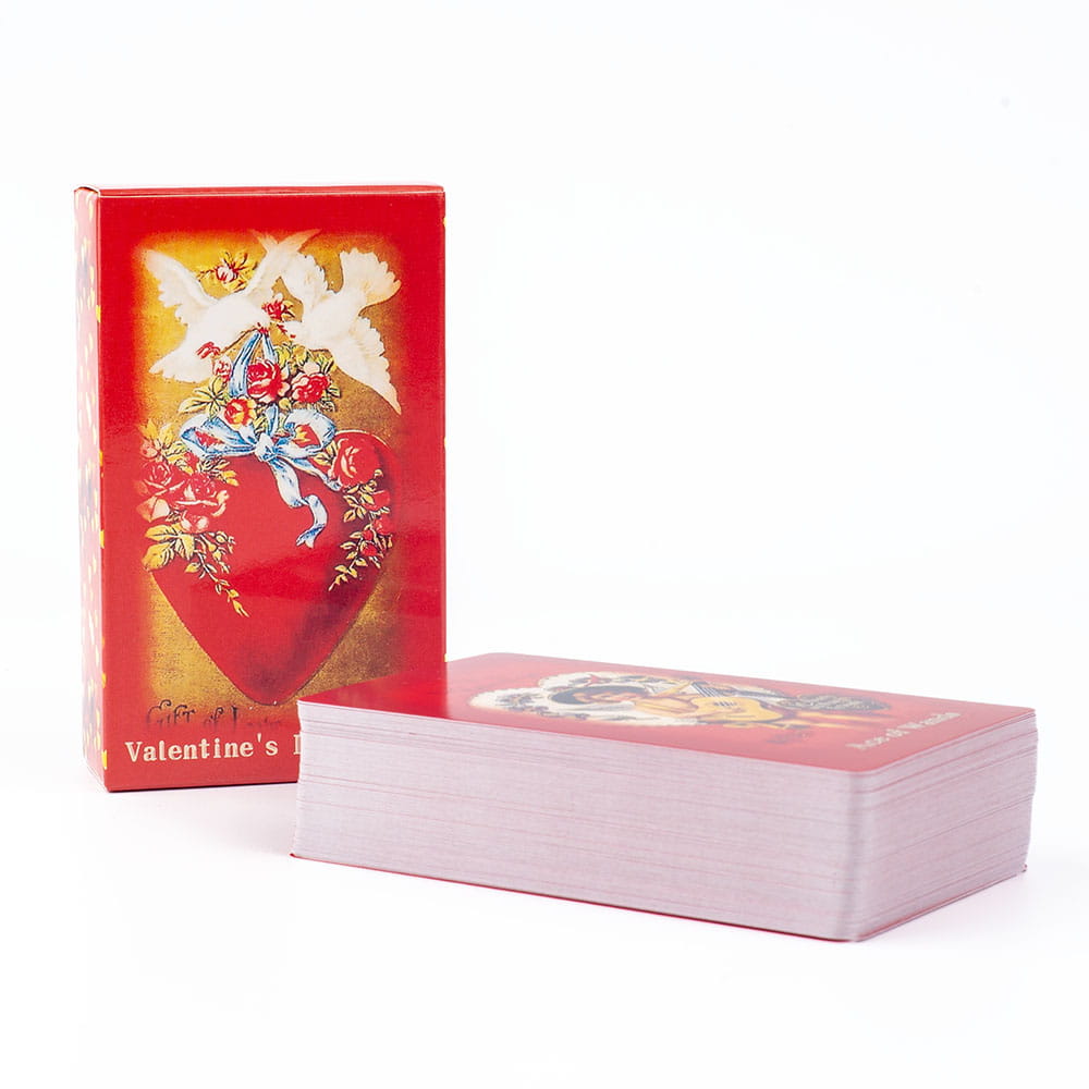 a red valentine tarot deck love oracle cards playing card set in a matching box featuring ornate white doves and roses around a heart on the back design
