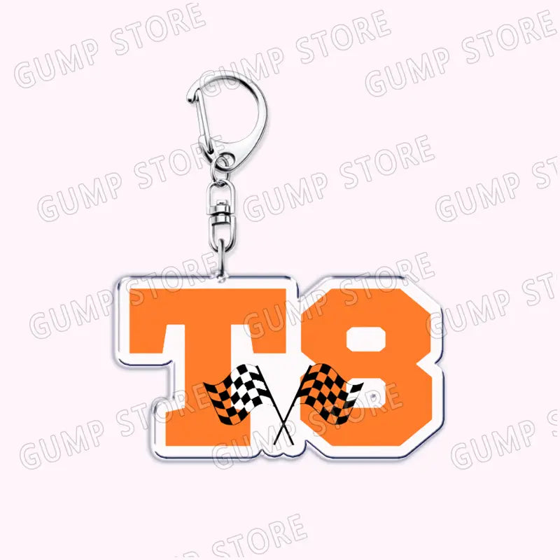 Orange and white acrylic keychain featuring black and white checkered flags inside the number 18 design for Tate Mcrae music fan gift.