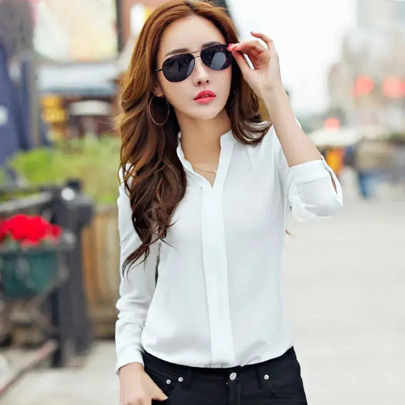 white long-sleeved button-up blouse with classic collar and rolled cuffs for office wear