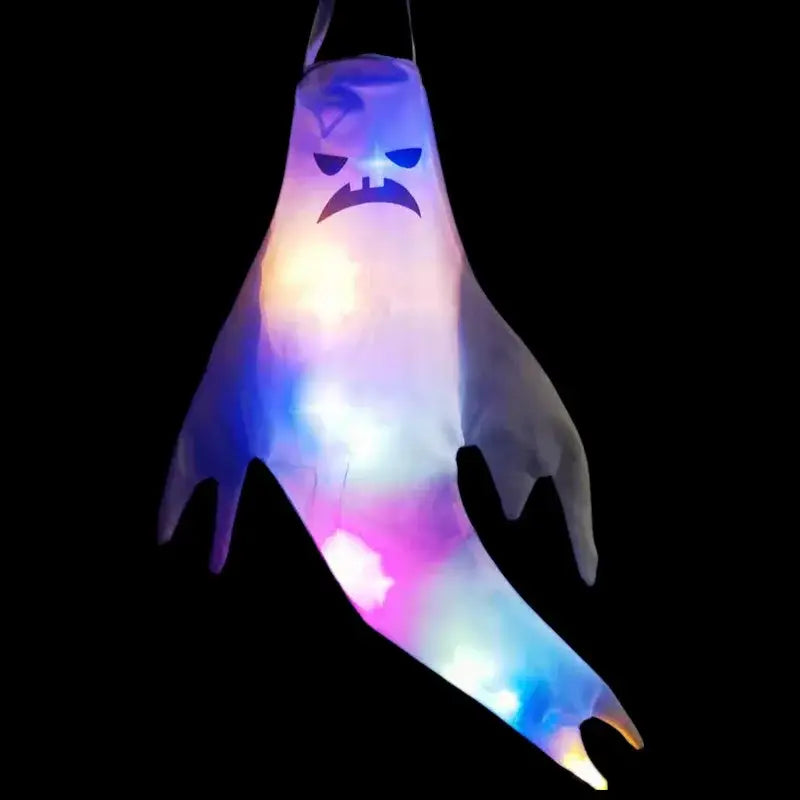 A glowing inflatable halloween ghost led hanging windsock with a menacing face and colorful led lights for home outdoor decoration.