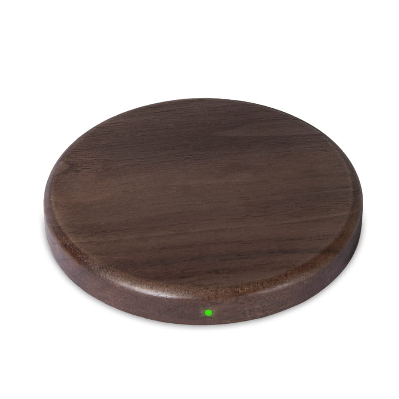 Dark brown walnut wood circular wireless charging pad with 15w power and green indicator light.