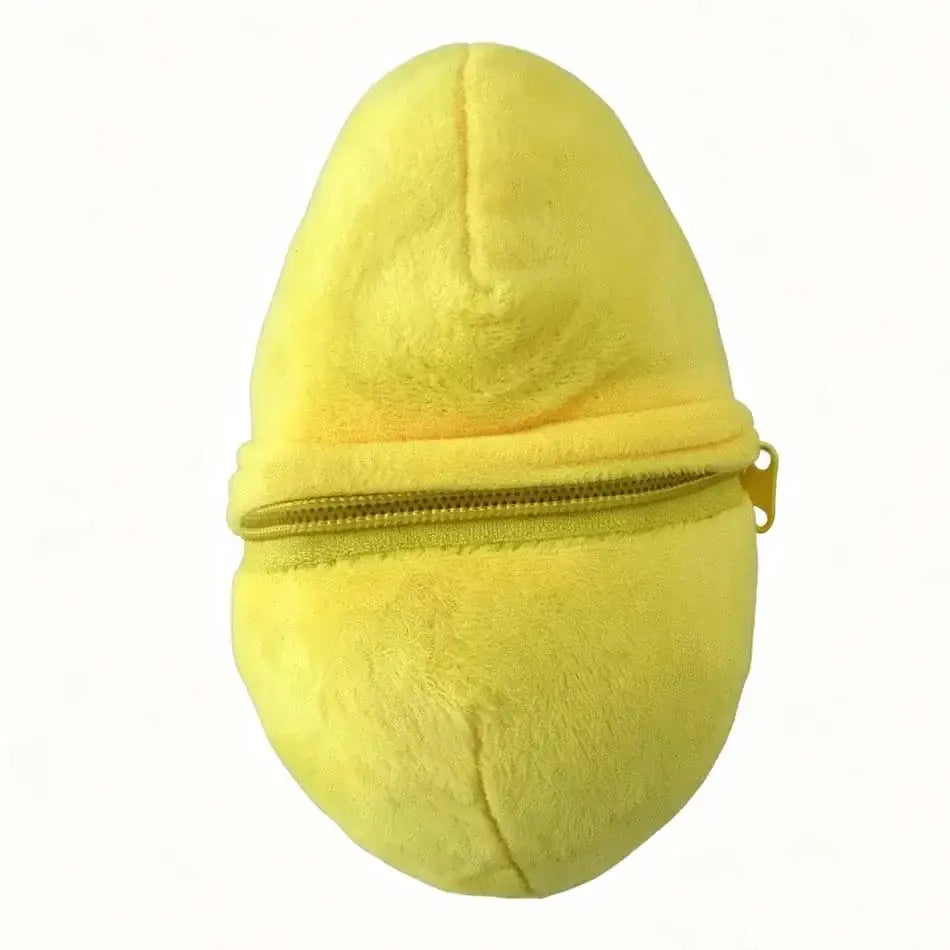 Bright yellow plush egg-shaped coin purse made of soft stuffed animal material with a zipper closure.