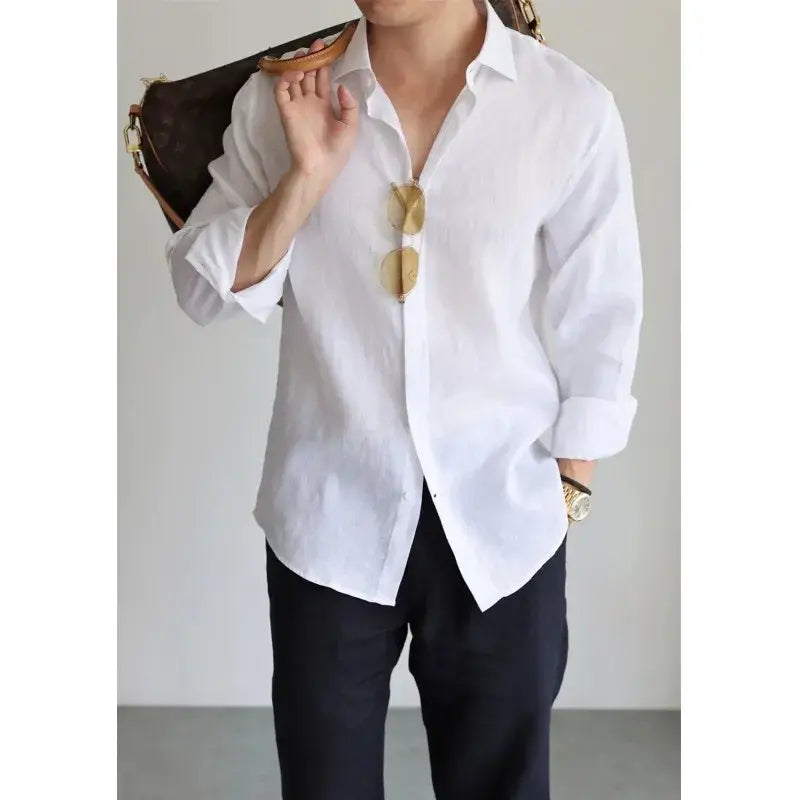 Men cotton linen casual button down shirt in white with rolled sleeves and a relaxed fit.