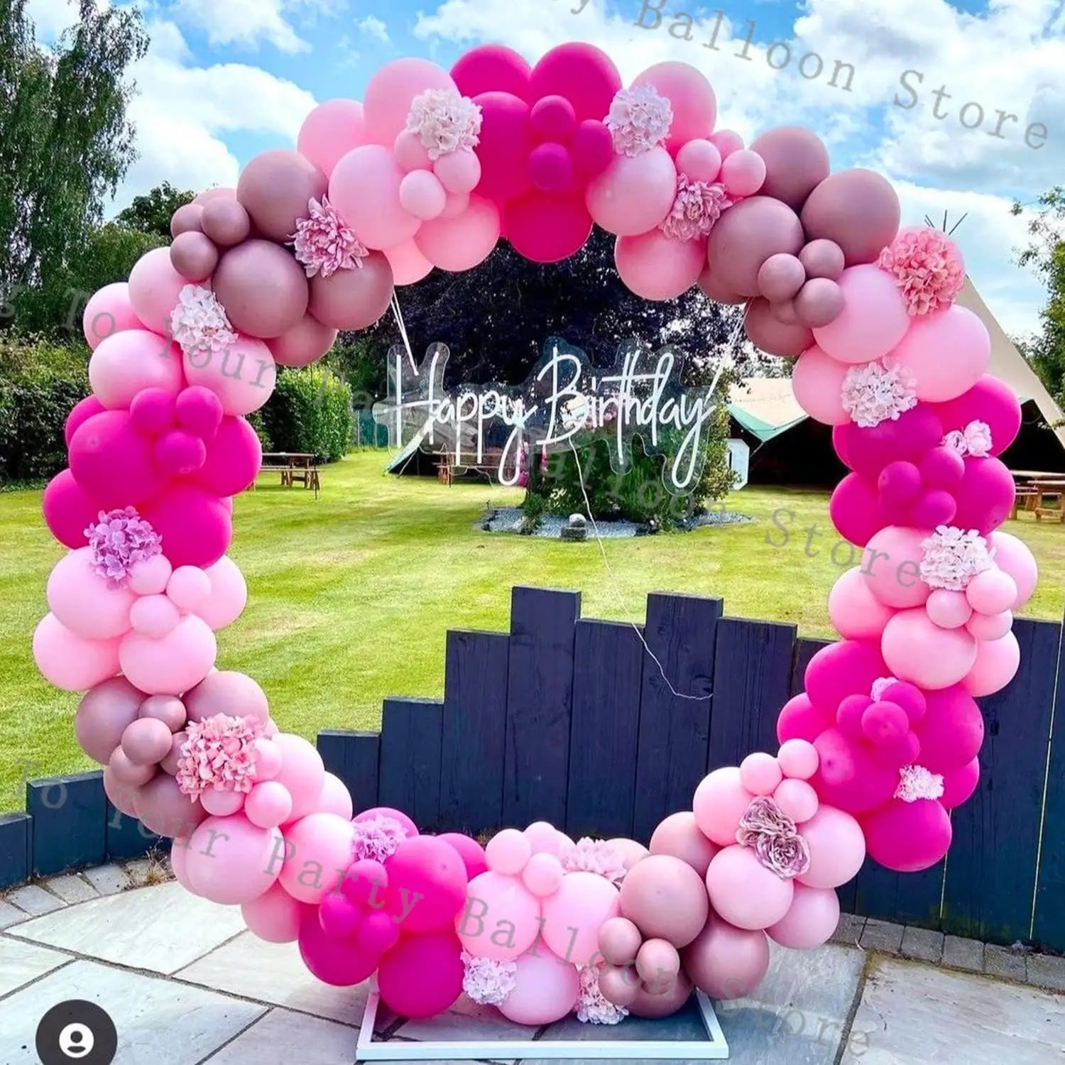a vibrant pink and mauve balloon arch kit featuring a gradient of shades from light to deep pink with floral decorations designed for weddings and birthday parties