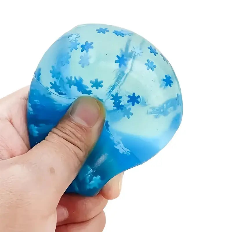 a translucent blue ice cubes slow rising squishy sensory fidget toy stress ball with embedded star-shaped patterns and a gradient effect from light to dark blue