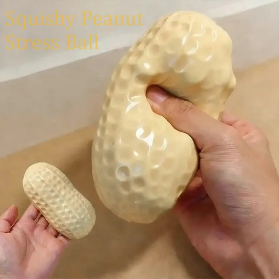 cream-colored peanut squishy filled stress toy shaped like a peanut with a textured surface and squishy filled material for stress relief