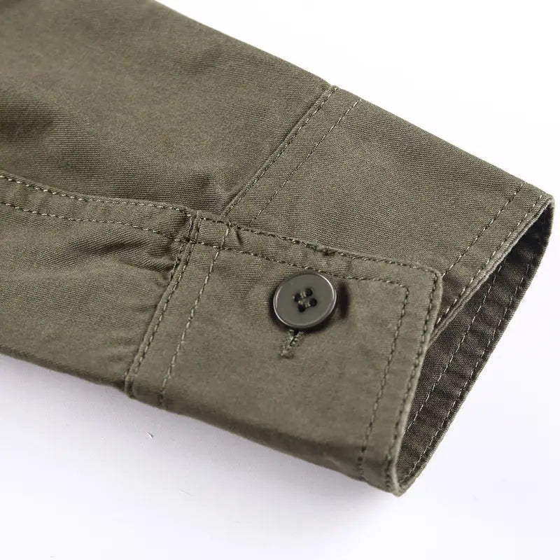Olive green cotton sleeve of a men cotton casual long sleeve military cargo shirt with a dark gray four-hole button.