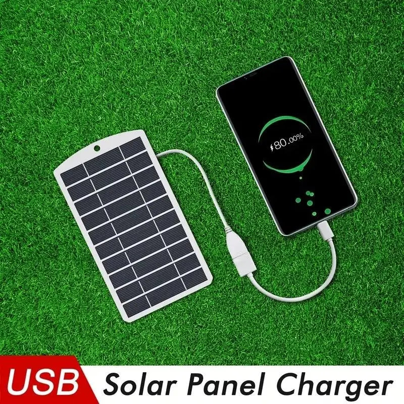 weißer USB-Solarladegerät mit schwarzen Photovoltaikzellen und einem weißen Ladekabel, verbunden mit einem Smartphone zur tragbaren Nutzung im Freien als 2W-USB-Solarladegerät-Powerbank