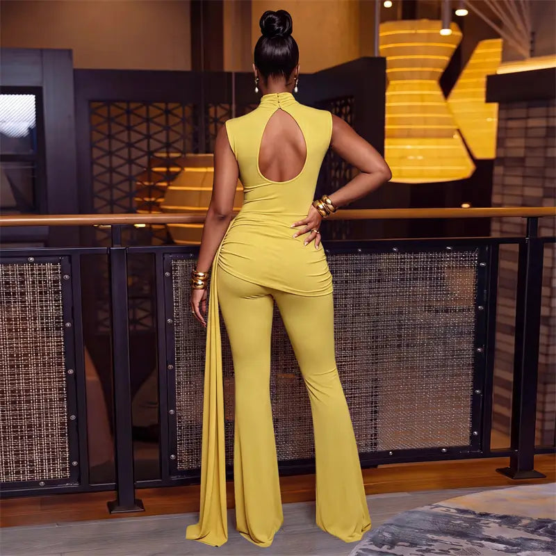 A vibrant yellow sleeveless jumpsuit with ruched detailing, high neckline, back cutout, flare legs, and zipper closure type in a piece sets woman outfit.