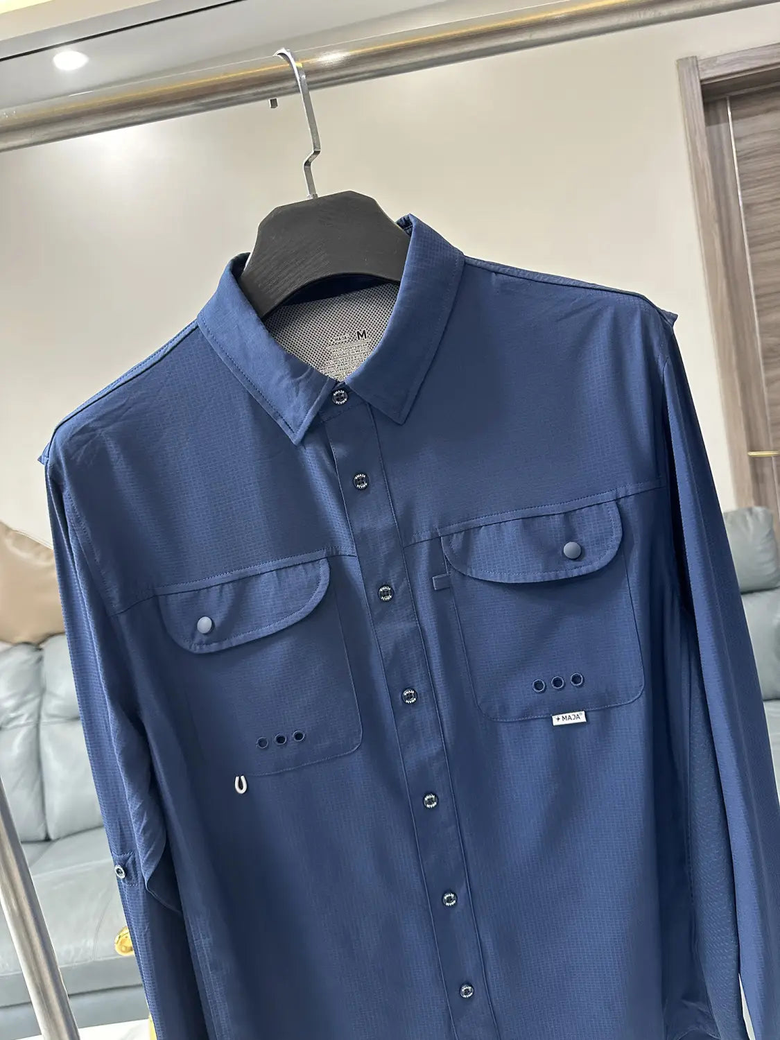 Men’s tactical outdoor long sleeve shirt in blue with button-up front two chest pockets and subtle stitching details.