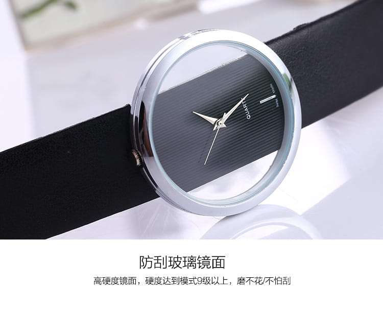 Women luxury leather quartz watch featuring a silver-toned round case with a transparent black textured dial, minimalist silver hands and markers, and a sleek black leather strap.