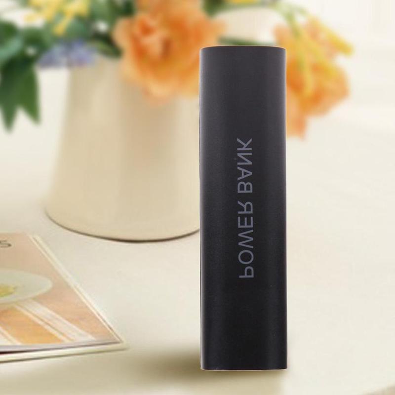 black cylindrical portable 18650 power bank case diy shell charger with power bank printed vertically in white lettering