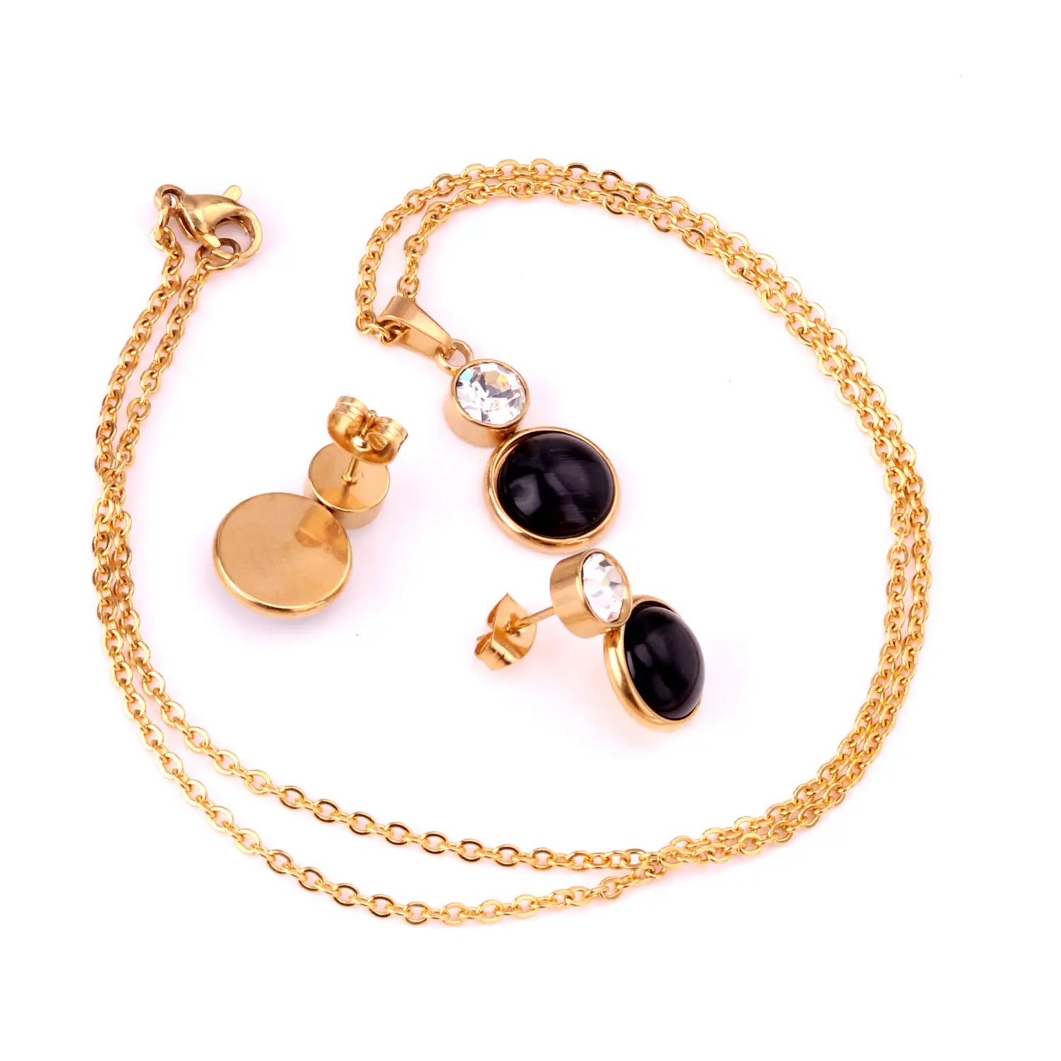 Gold-toned stainless steel black opal necklace and earring set with black oval pendant and clear crystal accents.