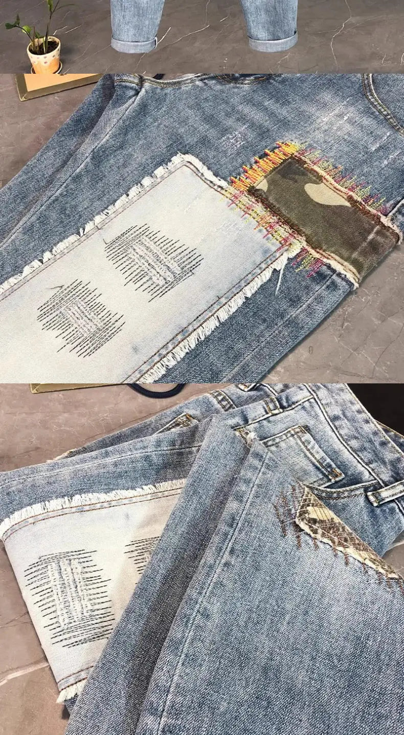 Distressed slim fit light wash denim jeans with patchwork design featuring frayed edges, faded white denim panel, and camouflage-patterned fabric.