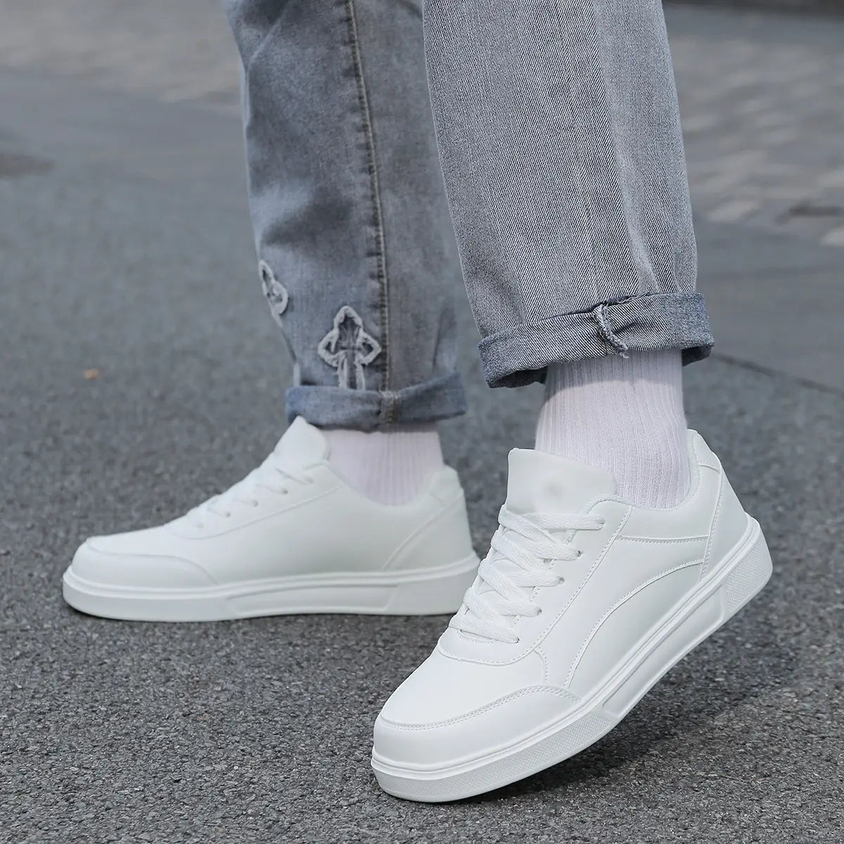 Men white leather minimalist low top sneakers featuring a clean design with smooth leather upper.