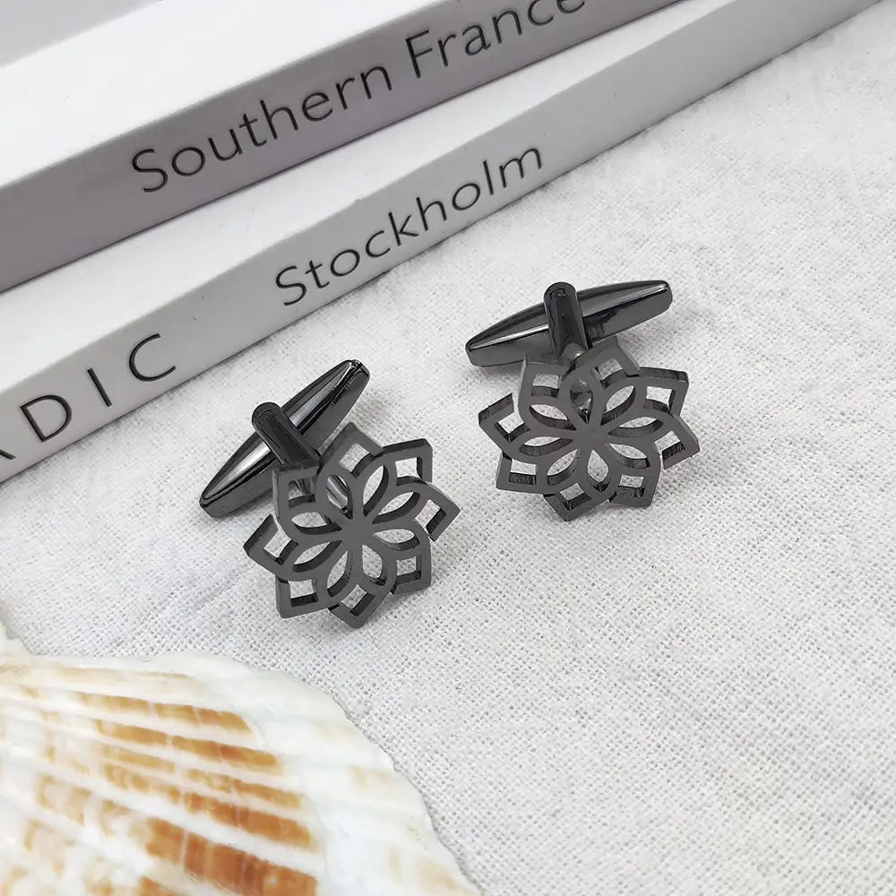 Black metallic stainless steel floral cufflinks for men featuring an intricate symmetrical floral cutout design.