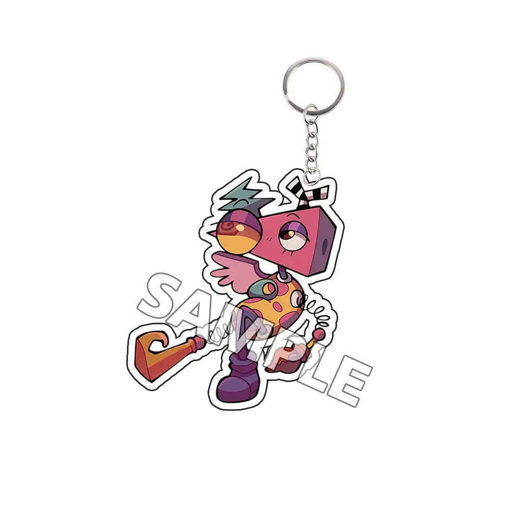 Producto terminado de llavero acrílico tipo TADC que presenta un personaje caricaturesco colorido, con una cabeza cuadrada rosa y botas moradas.