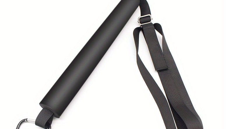 Black padded volleyball spike training system bar with adjustable straps and metal carabiner clip for outdoor resistance training.