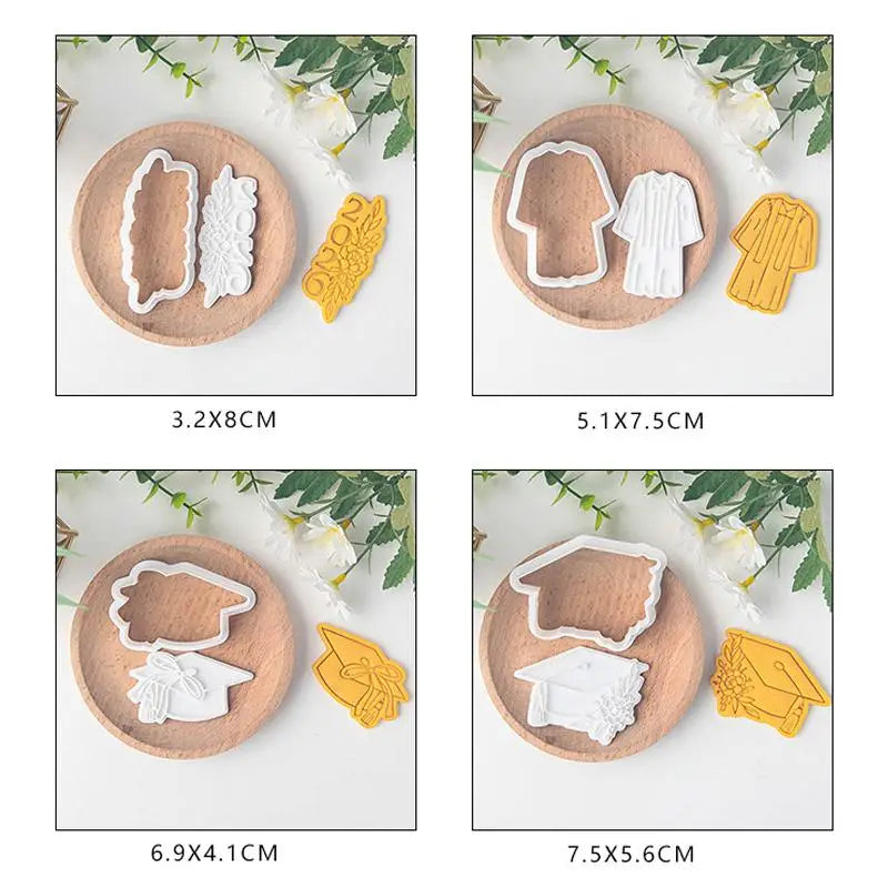 The 2026 graduation cookie cutter set features white and yellow plastic cutters shaped like caps gowns and tassels designed for graduation-themed baking.