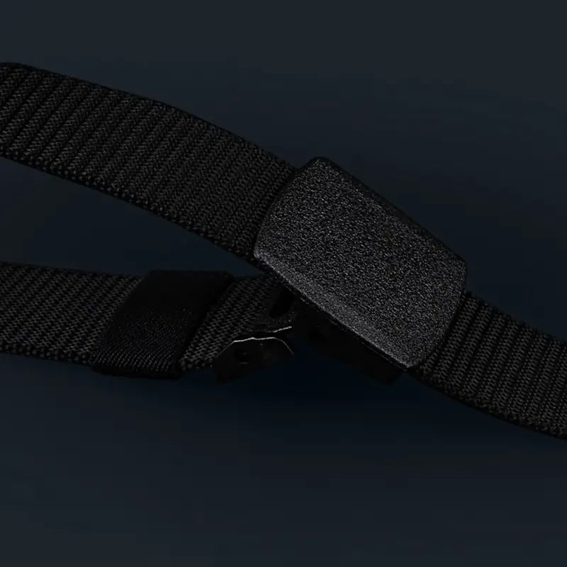 mens tactical canvas belt featuring a black woven nylon strap with a lightweight matte black plastic automatic buckle.