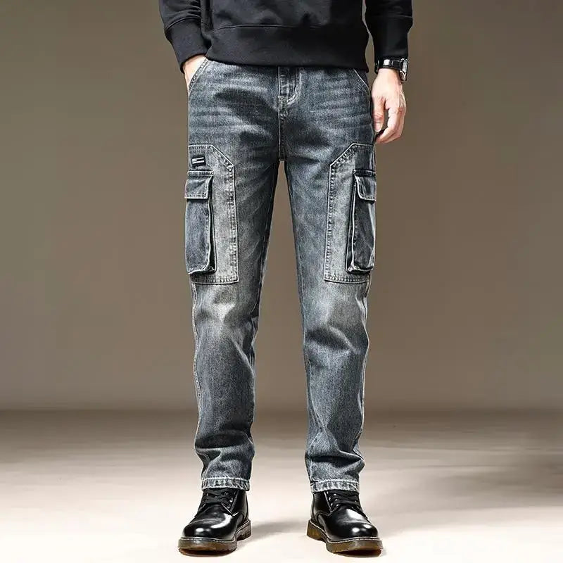 baggy dark wash denim cargo pants with large side pockets and a slightly faded distressed look made from dark-wash denim material.