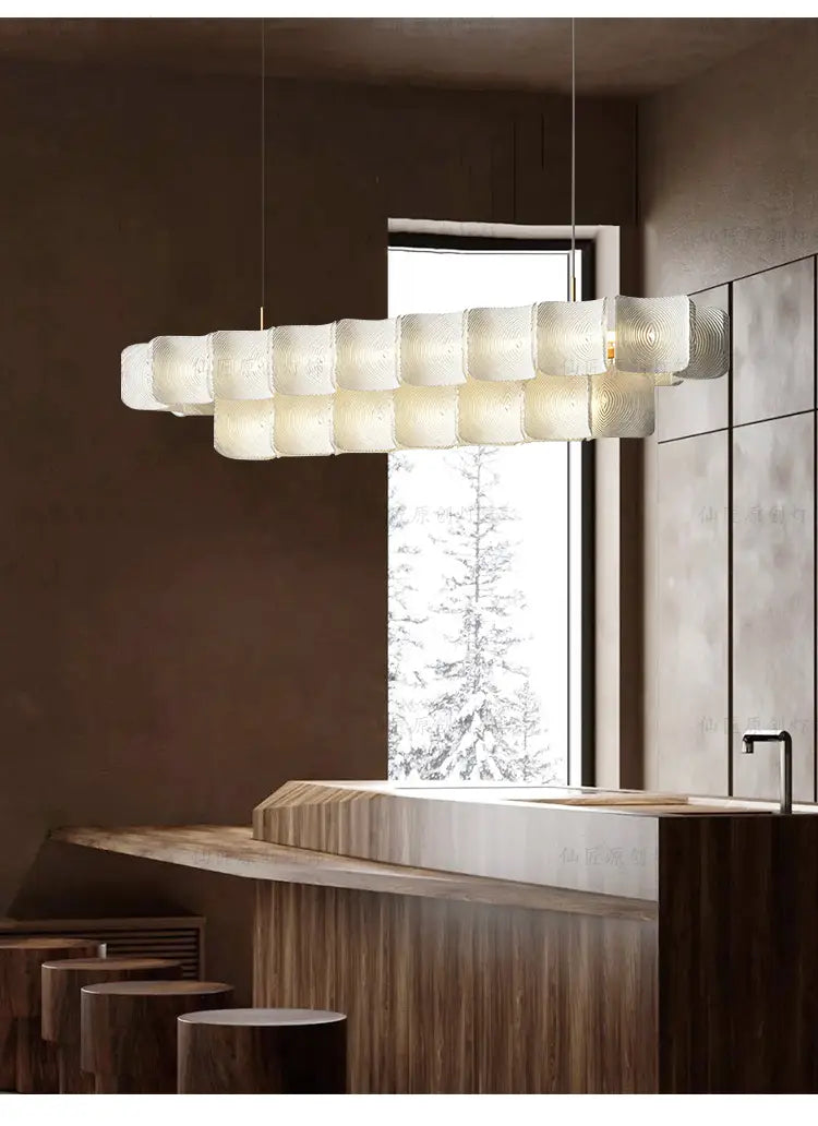 Minimalist Wabi Sabi led chandelier pendant light featuring a modern pendant light fixture with frosted textured glass segments arranged in an elongated horizontal line.