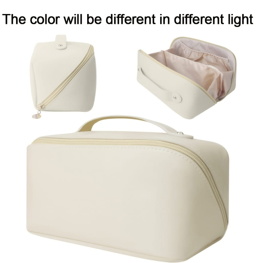 Beige Stoff-Reise-Make-up-Tasche und Kosmetikorganizer mit einer Kosmetiktasche in cremefarbener, weich strukturierter Ausführung, mit Tragegriff oben und Reißverschluss.