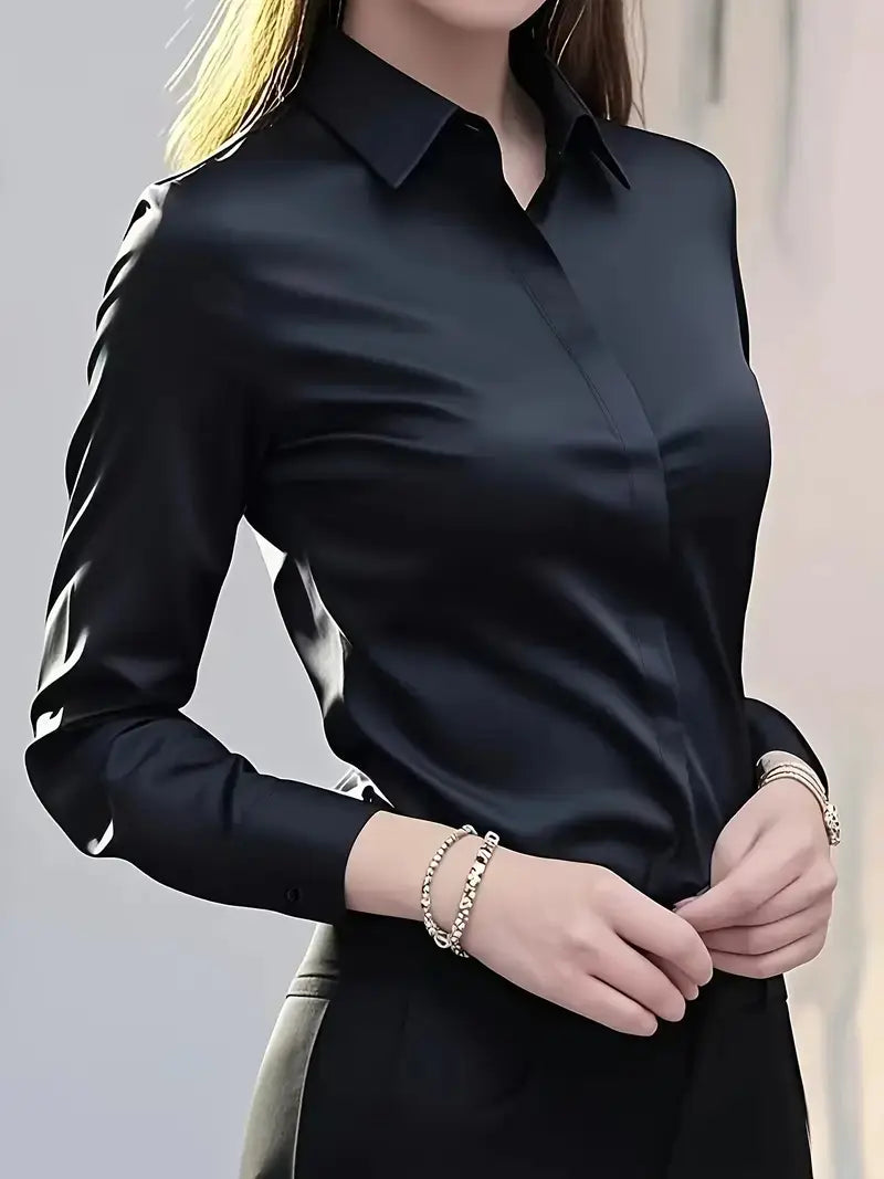 Women’s fitted long sleeve silk blouse dress shirt in black satin with a classic collar and button-up front featuring a subtle sheen