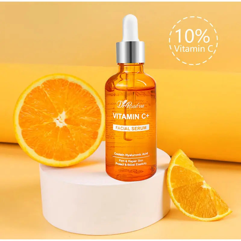 An orange-tinted glass bottle of Dr. in the vitamin C brightening skincare set designed for skin brightening.