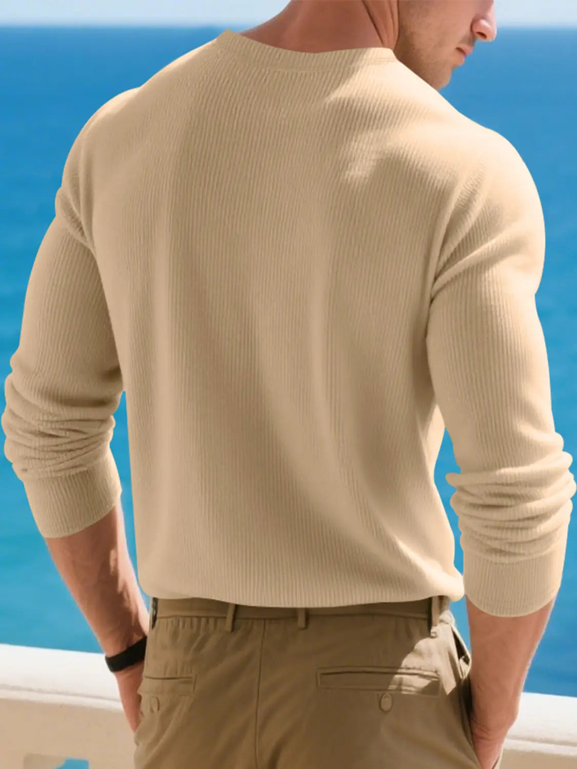 Beige ribbed knit long-sleeve henley shirt for men featuring a casual design.