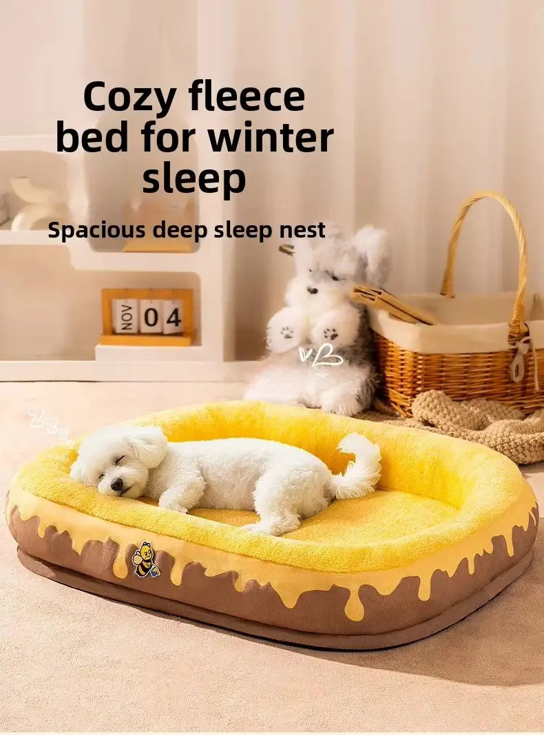 Plush donut dog bed in yellow and brown fleece with a honeycomb design and bee accent for pet comfort.